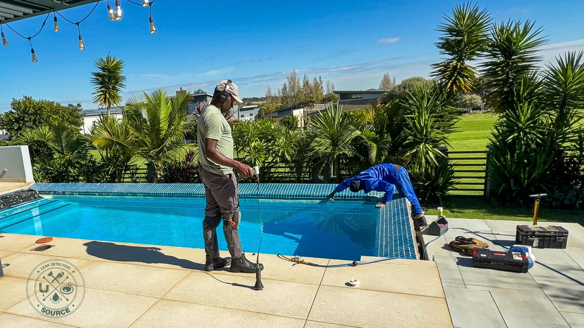 Source Leak Detection technicians running acoustic listening on a pool coping in bright Pretoria light